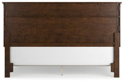 Ashley Furniture Danabrin Bed with dark wood finish and classic design, shown from the back in a well-lit room setting.