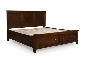 Ashley Furniture Danabrin panel storage bed with a dark wood finish and built-in storage drawers, shown from a closed angle.