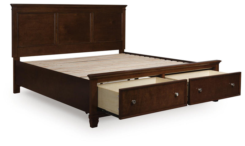 Ashley Furniture Danabrin Panel Storage Bed with open storage drawers and sleek design, shown from an angled open view.