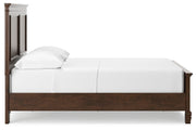 Ashley Furniture Danabrin Bed with a sleek wooden frame and side view showing its modern design and rich finish.