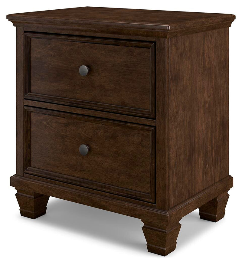 Ashley Furniture Danabrin nightstand with a dark wood finish and modern design, shown from an angled side view.