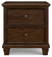 Ashley Furniture Danabrin nightstand with a dark wood finish and sleek drawer design, shown from a front head-on perspective.