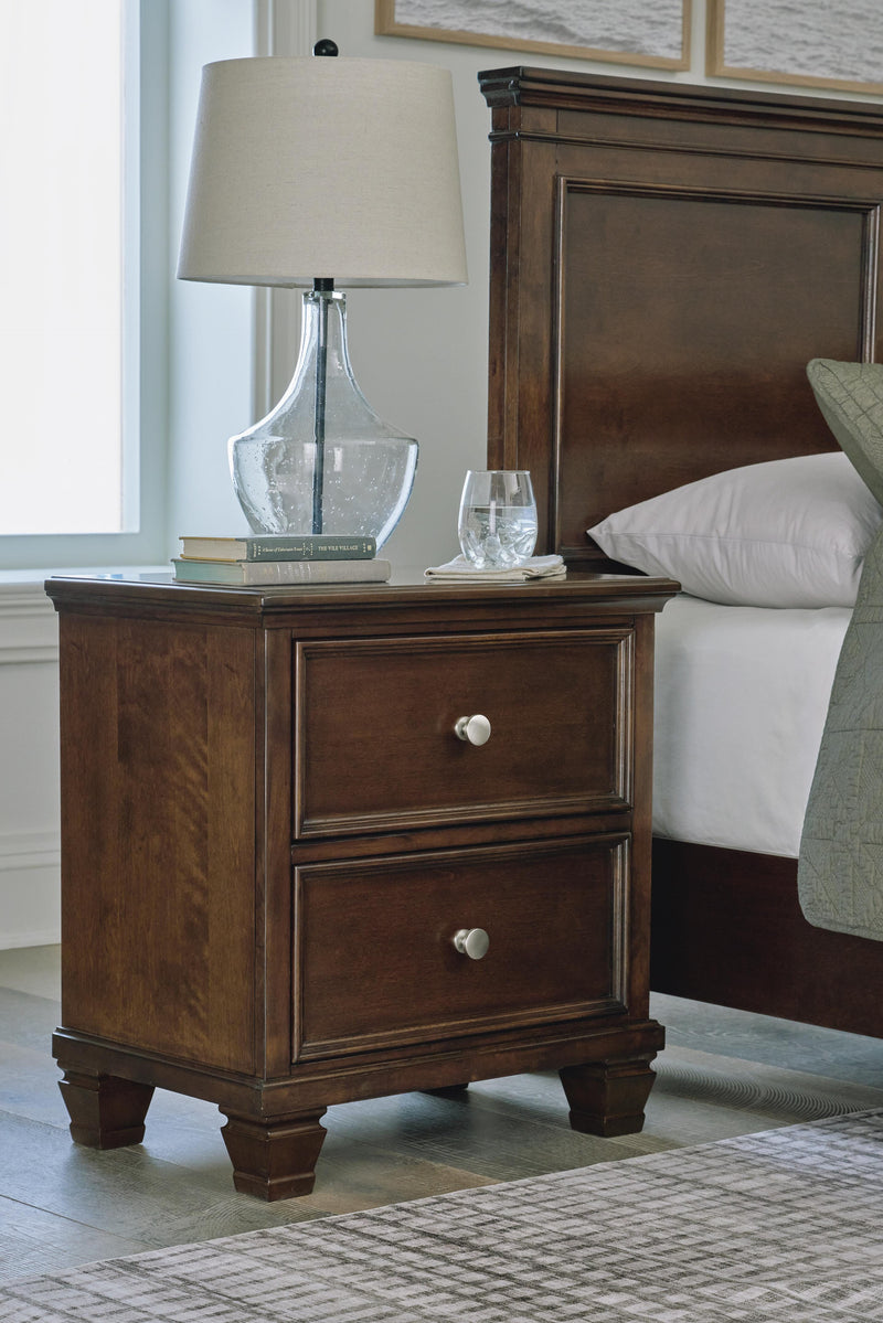Ashley Furniture Danabrin nightstand with a dark wood finish, featuring a single drawer and open shelf for bedside storage.