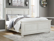 Ashley Furniture Robbinsdale bedroom set with a modern bed frame, matching nightstands, and a dresser in a stylish bedroom scene.