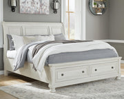 Ashley Furniture Robbinsdale bedroom set with a queen-sized bed, matching nightstands, and dresser in a modern bedroom display.
