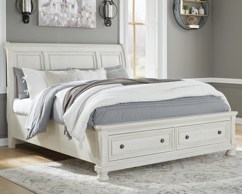 Ashley Furniture Robbinsdale bedroom set with a queen-sized bed, matching nightstands, and dresser in a modern bedroom display.