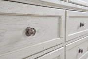 Ashley Furniture Robbinsdale bedroom set with a close-up of the handle detail on the dresser in a stylish bedroom scene.