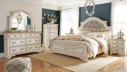 Ashley Furniture Realyn upholstered bed with a plush fabric headboard and elegant design in a cozy bedroom setting.