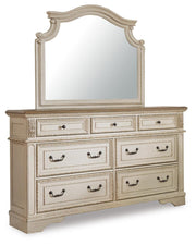 Ashley Furniture Realyn bedroom set with a bed, nightstands, and dresser in a contemporary design, shown in a stylish bedroom setup.