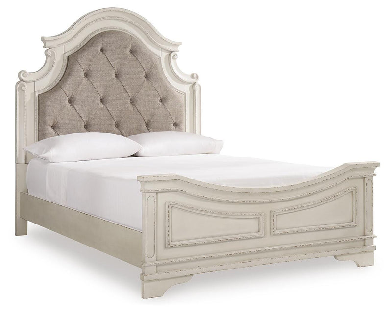 Ashley Furniture Realyn upholstered bed with a padded headboard in a neutral fabric, shown from a side angle.