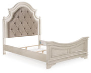 Ashley Furniture Realyn upholstered bed with plush fabric, featuring a modern headboard and clean-lined design in a stylish bedroom setting.