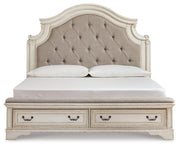 Ashley Furniture Realyn upholstered bed with a padded headboard in a stylish fabric, shown from a front head-on view.