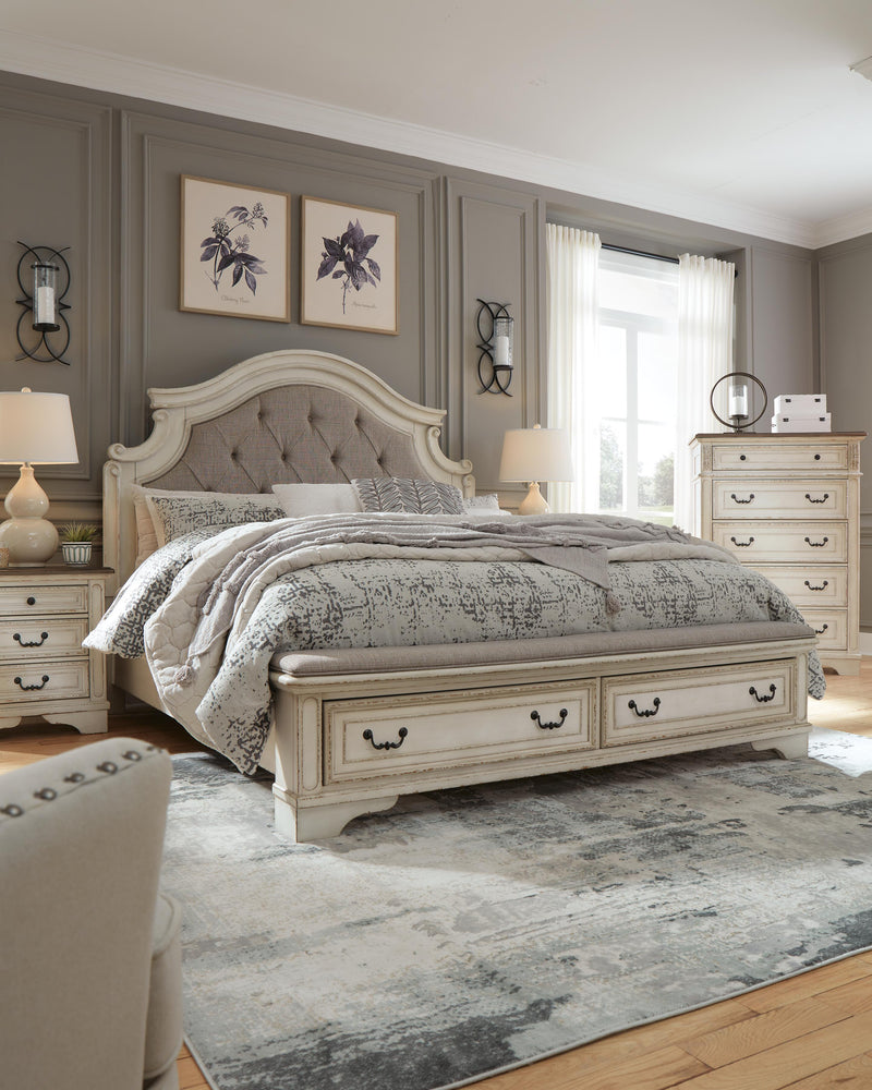 Ashley Furniture Realyn upholstered bed with a plush fabric headboard and stylish design, shown in a modern bedroom setting.