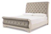 Ashley Furniture Realyn bedroom set with a bed, nightstands, and dresser in a stylish bedroom scene.