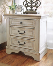 Ashley Furniture Realyn bedroom set featuring a bed frame, nightstands, and matching dresser in a modern bedroom decor.