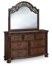 Ashley Furniture Lavinton bedroom set with a modern bed frame, matching nightstands, and dresser in a contemporary bedroom décor.