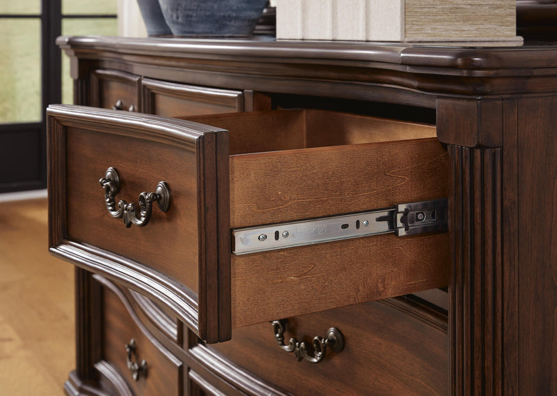 Ashley Furniture Lavinton bedroom set featuring a dark wood bed frame and matching nightstands with detailed craftsmanship.