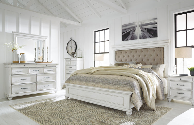 Ashley Furniture Kanwyn bedroom set featuring a bed, nightstands, and dresser in a modern bedroom decor style.