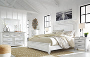 Ashley Furniture Kanwyn bedroom set with a modern bed frame, matching nightstands, dresser, and mirror in a stylish bedroom setup.