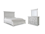 Ashley Furniture Kanwyn bedroom set featuring a bed, nightstands, and matching dresser with elegant wood finish.