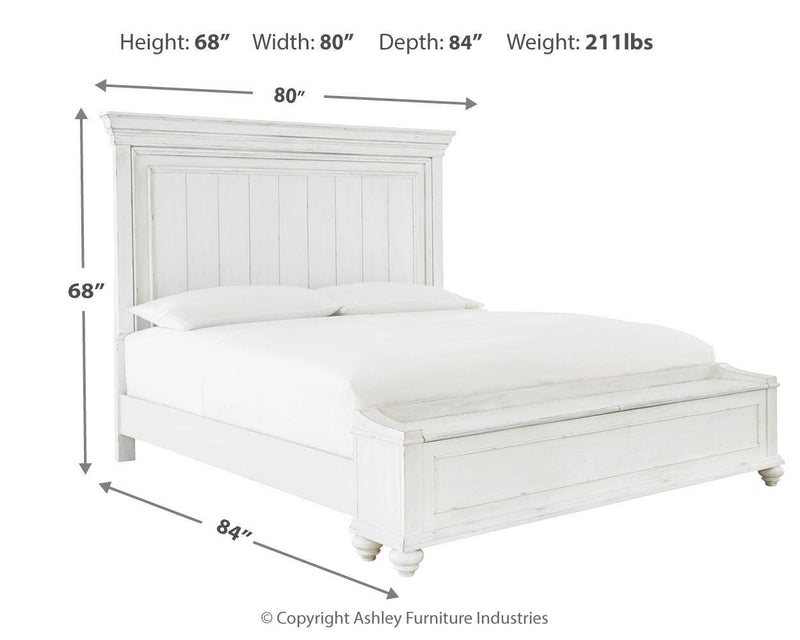 Ashley Furniture Kanwyn bedroom set featuring a bed with a padded headboard and matching nightstands in a modern design.