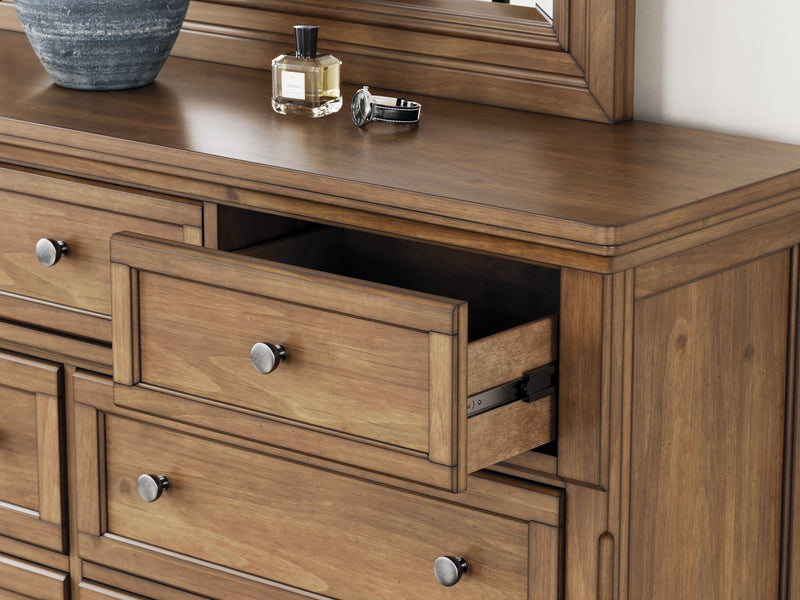 Ashley Furniture Feddinger bedroom set with a modern bed frame, matching nightstands, and a stylish dresser in a cozy bedroom setting.