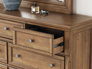 Ashley Furniture Feddinger bedroom set with a wooden bed frame, matching nightstands, and a cozy, stylish bedroom interior.