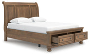 Ashley Furniture Feddinger bedroom set featuring a bed, nightstands, and dresser with a modern design in a cozy bedroom setting.