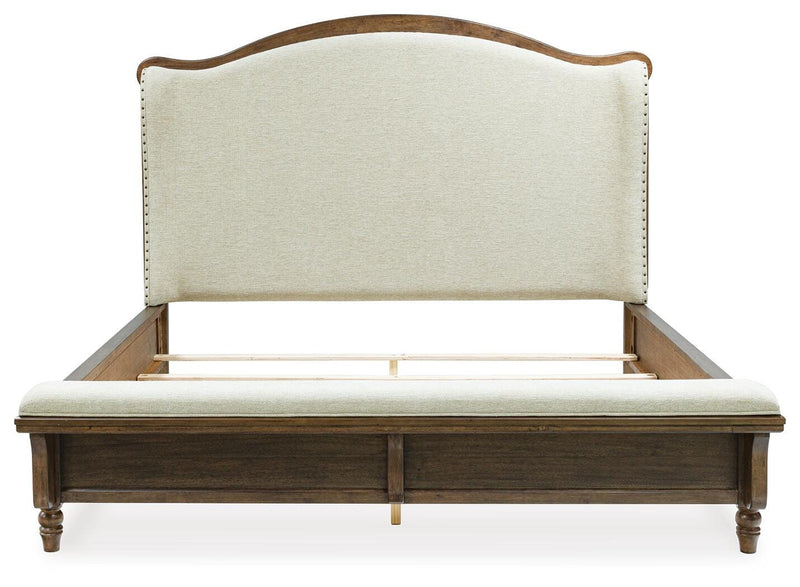 Ashley Furniture Sturlayne upholstered bed with headboard, beige fabric, and clean-lined design, shown from a front head-on view.