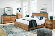 Ashley Furniture Dressonni bedroom set with bed, dresser, and nightstands in a stylish bedroom arrangement.