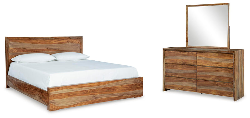 Ashley Furniture Dressonni bedroom set including a bed frame, nightstands, and dresser in a stylish, coordinated bedroom package.