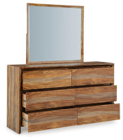 Ashley Furniture Dressonni bedroom set with a bed, nightstands, and dresser, shown from an angled view in a modern bedroom setting.