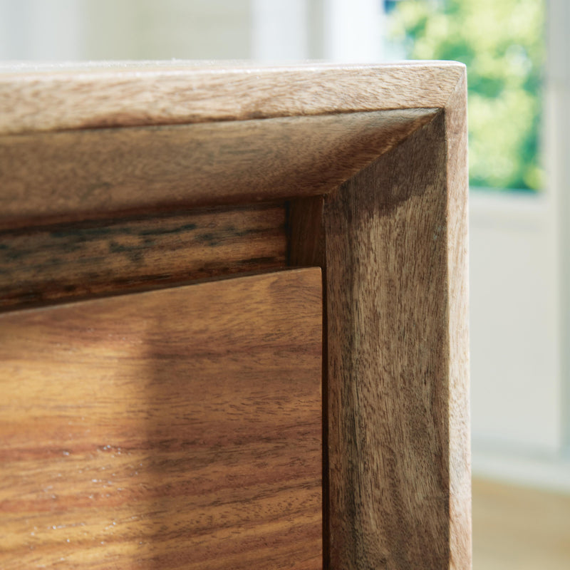 Ashley Furniture Dressonni nightstand with beveled frame, featuring a sleek wood finish and modern design details.