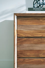 Ashley Furniture Dressonni Dresser with sleek wood finish and modern design, featuring multiple drawers and metal handles.