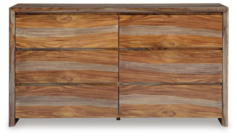Ashley Furniture Dressonni dresser showcasing sleek wood finish and modern design with multiple drawers for storage.