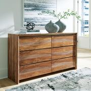 Ashley Furniture Dressonni Dresser with sleek wood finish and multiple drawers, showcasing modern bedroom storage design.