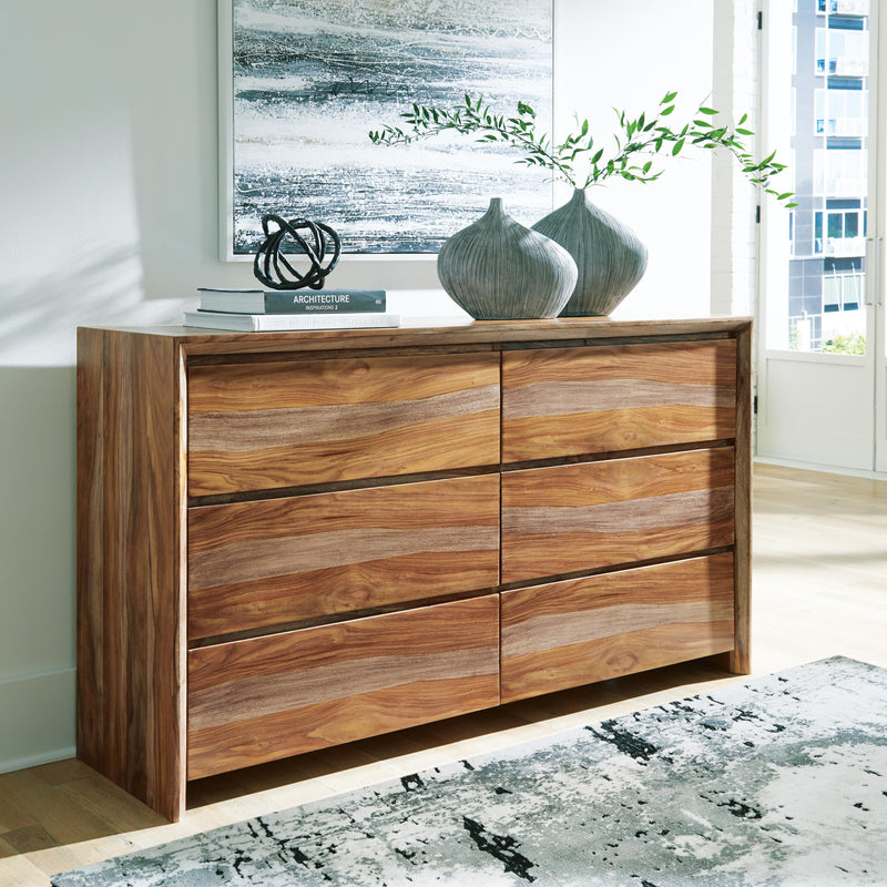Ashley Furniture Dressonni Dresser with sleek wood finish and multiple drawers, showcasing modern bedroom storage design.
