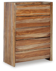 Ashley Furniture Dressonni chest of drawers with sleek wood finish, featuring multiple drawers and modern design.