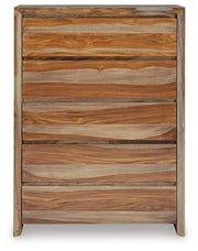Ashley Furniture Dressonni chest of drawers with a sleek wood finish, featuring multiple drawers and modern design.