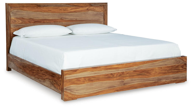 Ashley Furniture Dressonni bedroom set with a large bed, nightstands, and matching dresser in a stylish bedroom scene.