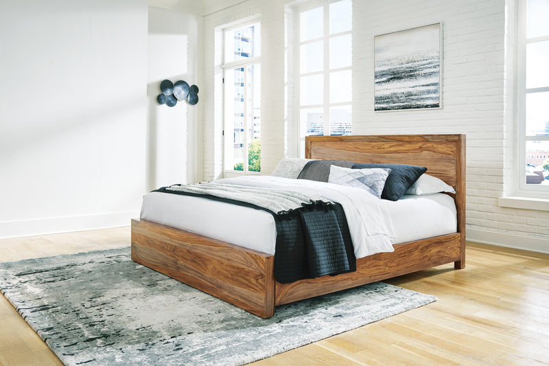 Ashley Furniture Dressonni bedroom set with bed frame, dresser, and nightstands in a stylish bedroom arrangement.