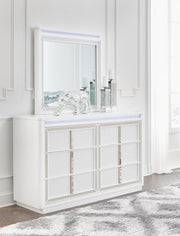Ashley Furniture Chalanna Bedroom Set with LED lighting, featuring a modern bed frame and matching nightstands, in a stylish bedroom scene.