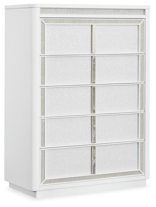 Ashley Furniture Chalanna chest of drawers, angled view showing sleek wooden finish and multiple storage drawers.
