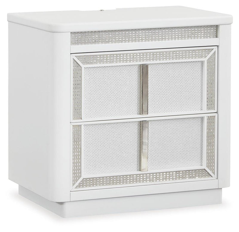 Ashley Furniture Chalanna nightstand with a closed drawer and angled design, shown from a side angle in a modern bedroom setting.