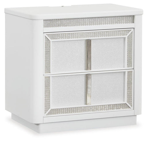 Ashley Furniture Chalanna nightstand with a closed drawer and angled design, shown from a side angle in a modern bedroom setting.