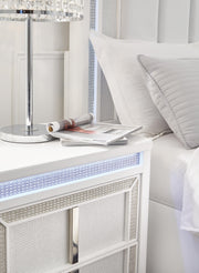 Ashley Furniture Chalanna nightstand with LED lighting, featuring a modern wood finish and sleek design for bedroom decor.