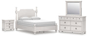 Ashley Furniture Rowlenstown bedroom set with a bed, nightstands, and dresser in a cozy bedroom scene.
