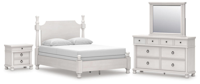 Ashley Furniture Rowlenstown bedroom set with a bed, nightstands, and dresser in a cozy bedroom scene.