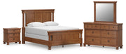 Ashley Furniture Rowlenstown bedroom set with bed frame, dresser, and nightstands in a modern bedroom design.