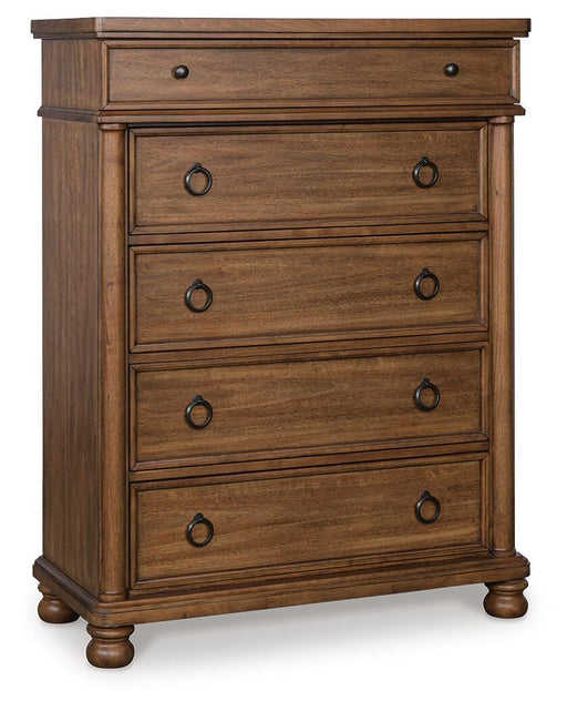 Ashley Furniture Chadworth chest of drawers, angled view showing wooden finish and multiple drawers for storage.